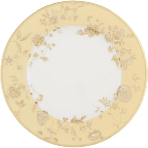 Bajo plato dorado y blanco de porcelana y diseño original.
