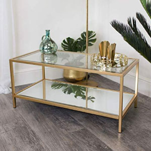 Mesa de centro larga rectangular de metal dorado, espejo y cristal.