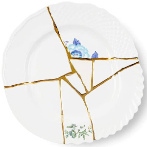 Plato dorado y blanco moderno de porcelana fina.